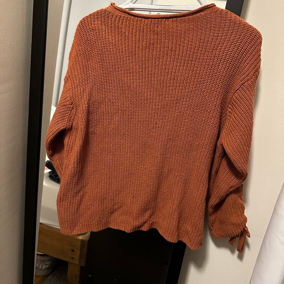 Orange knit sweater with ties on arms - Picture 2 of 3